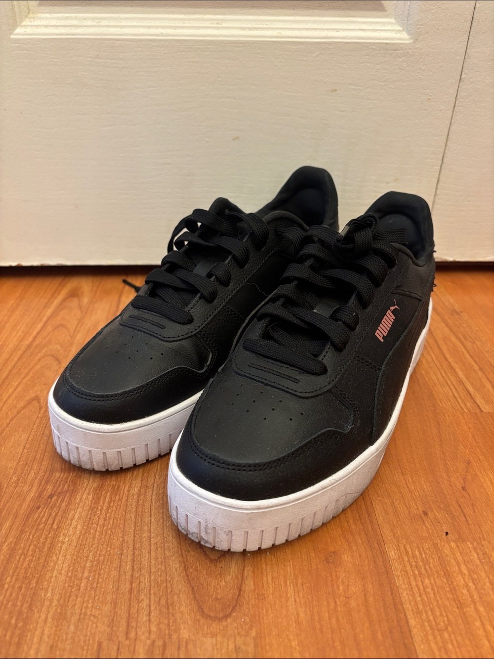 Puma Women’s Black Sneakers with Pink Logo Accent